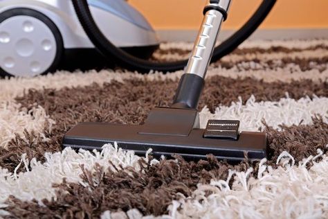 a vacuum cleaner on a carpet